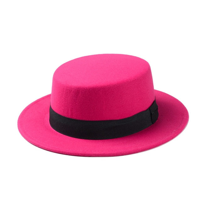 Wide brim pink gambler hat with black band, perfect for women’s alternative fashion and rock-n-roll style.