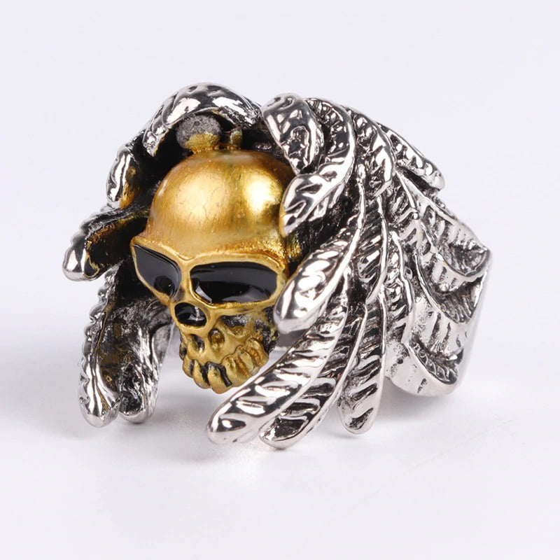 Winged skull ring with gold and silver detailing, perfect for vintage steampunk and punk jewelry lovers.
