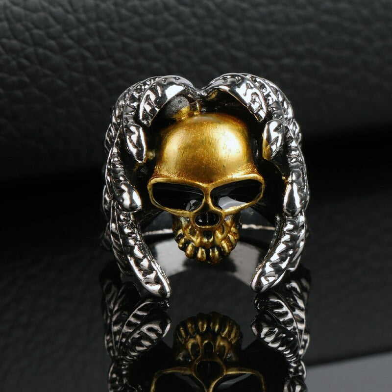 Winged skull ring in silver and gold, perfect for steampunk and punk fans, available in sizes 7-14.