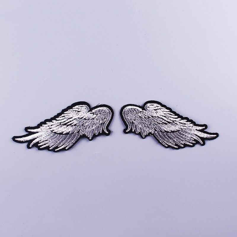 Wings shape fusible patch, stylish rock accessory for jackets and bags, featuring silver embroidery on black outline.