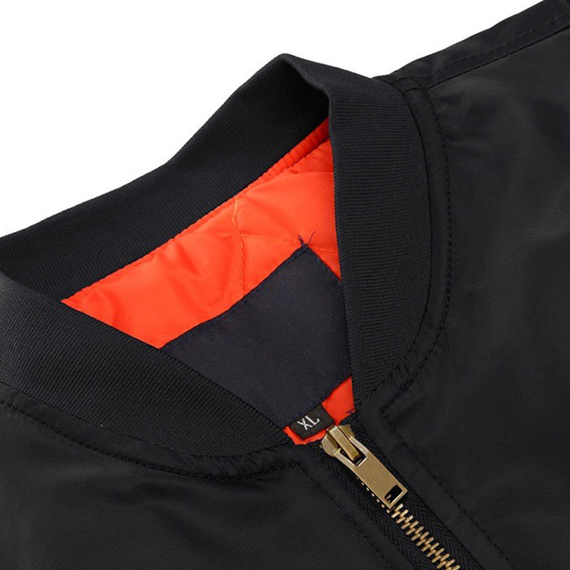 Close-up of the Winter Military Jacket's zipper and collar, showcasing the stylish black exterior and vibrant orange lining.