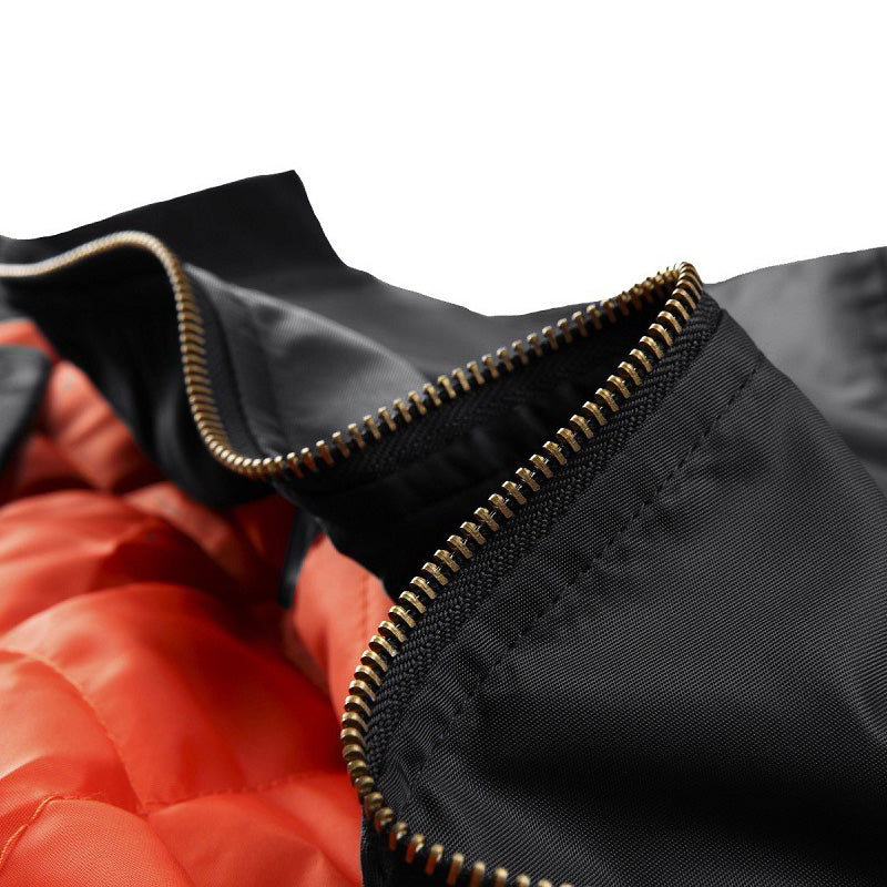 Close-up of the zipper on a cotton padded pilot MA-1 bomber jacket showcasing stylish military design.