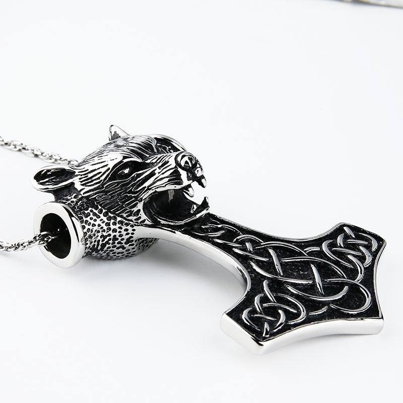 Wolf head pendant necklace with Thor's hammer design in Viking style, showcasing intricate Celtic detailing.