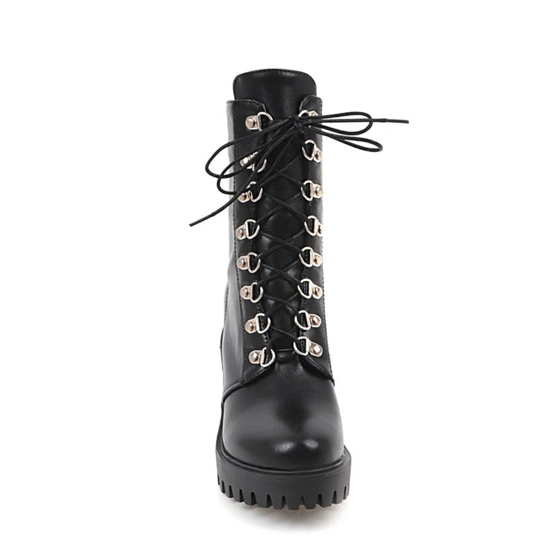 Trendy black women's gothic fashion boots with square heel and stylish lacing.