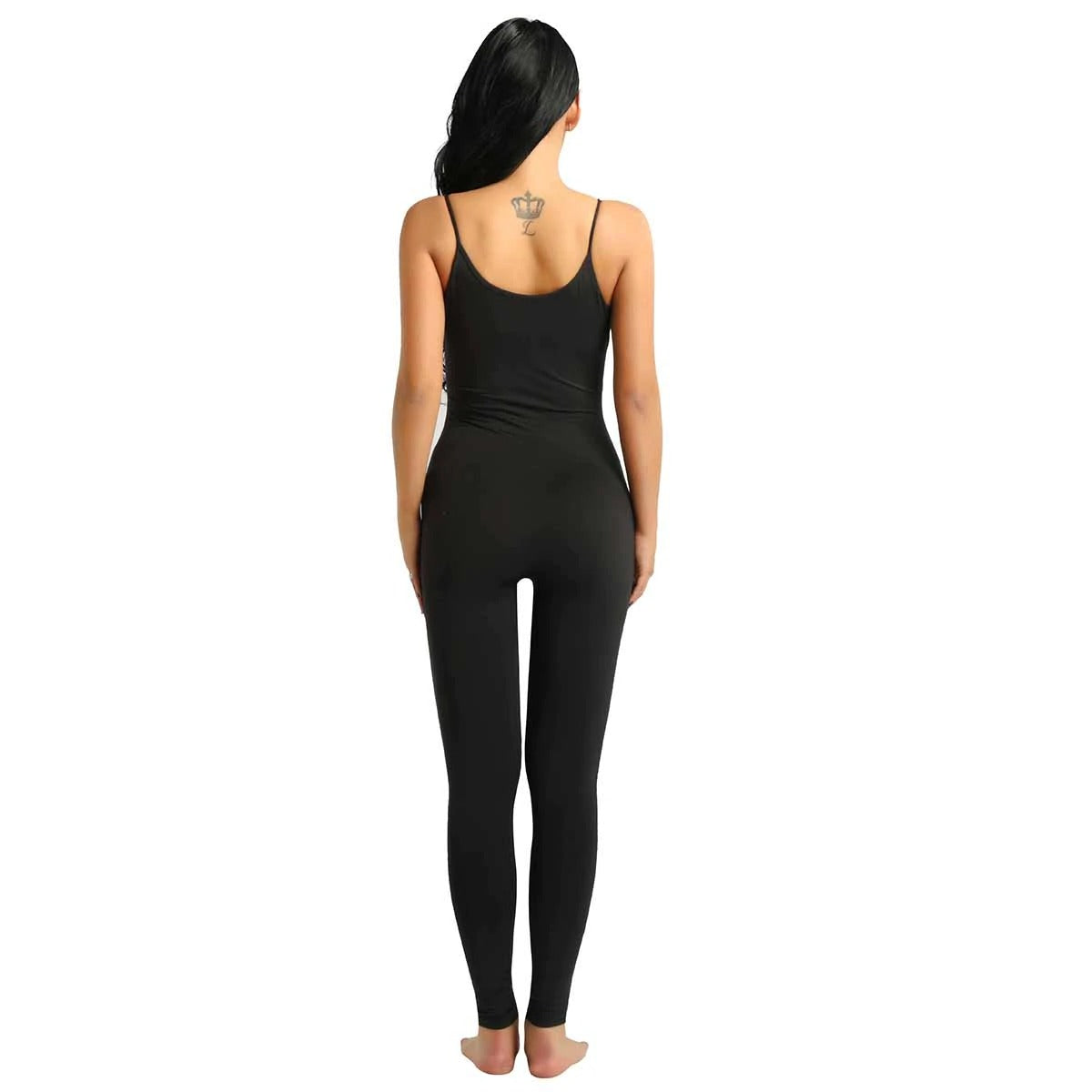 Back view of a woman wearing a black one-piece spaghetti strapped footless stretchy jumpsuit for comfort and style.