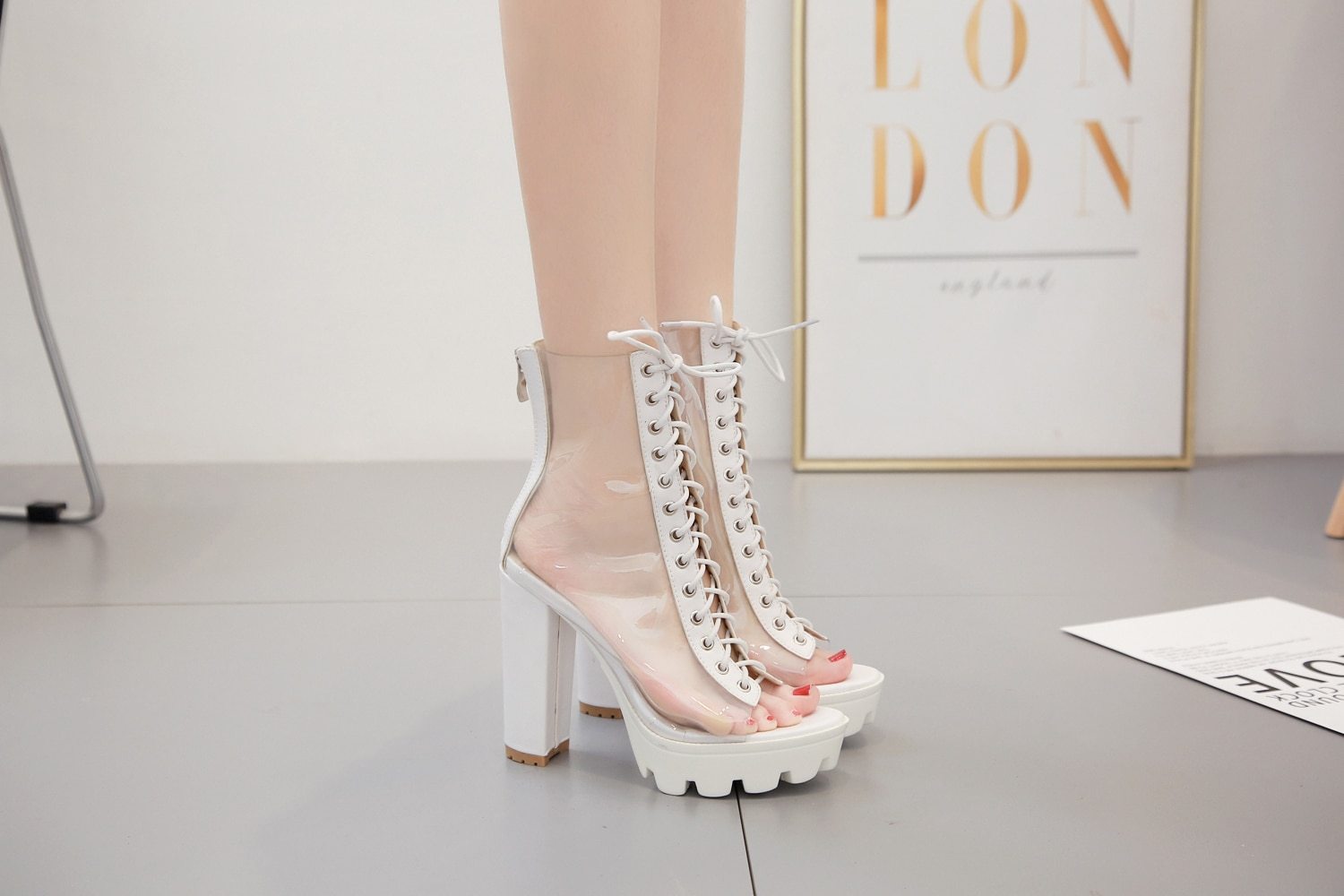 Trendy women ankle pumps with transparent design, peep toe, and back zip, perfect for stylish outfits and casual wear.