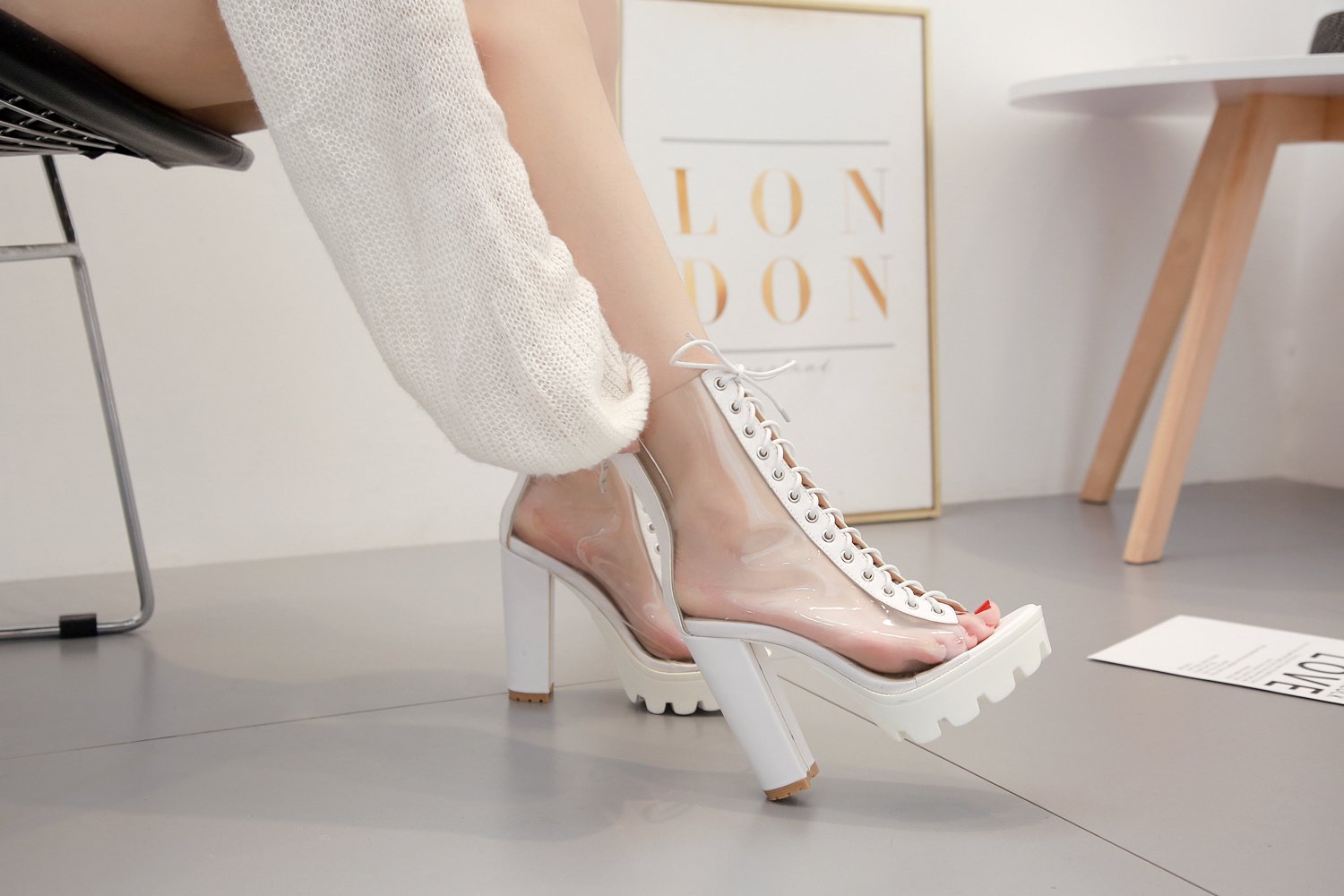 Stylish women ankle transparent pumps shoes with peep toe and cross ties, perfect for a trendy outfit.