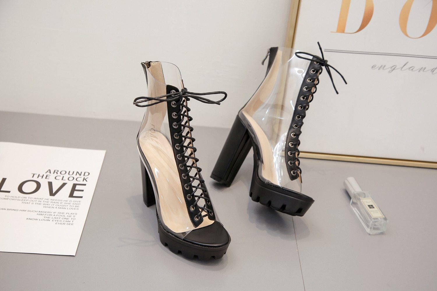 Women ankle pumps with transparent design, peep toe and cross tie, perfect for stylish outfits and various styles.