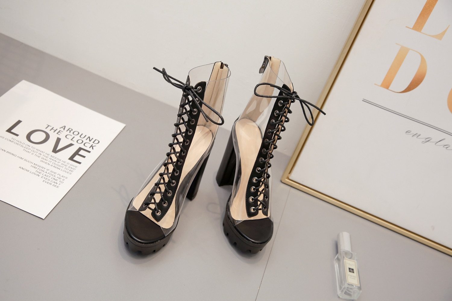 Women ankle transparent pumps with lace-up design and block heels, perfect for stylish outfits.