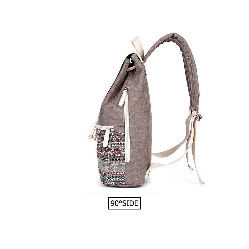 Stylish women backpack with national style printing design, showcasing embroidered details from a side view.