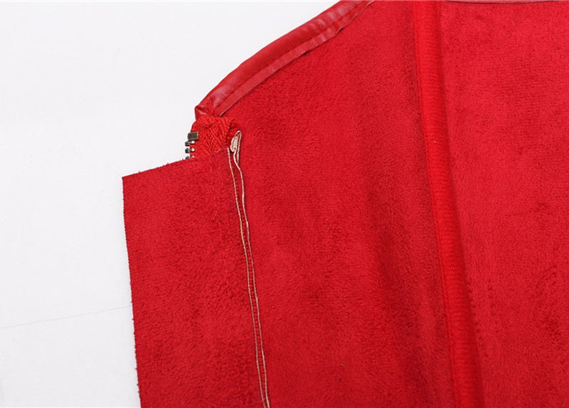 Close-up of the zipper on a red faux leather bustier, showing rich texture and easy-access design.