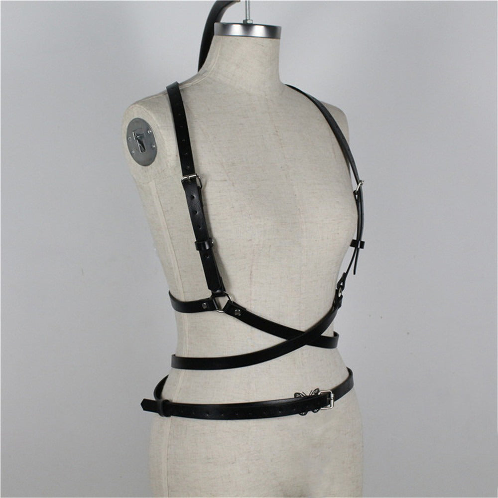 Gothic women's body harness made of imitation leather, adjustable and stylish for a bold fashion statement.