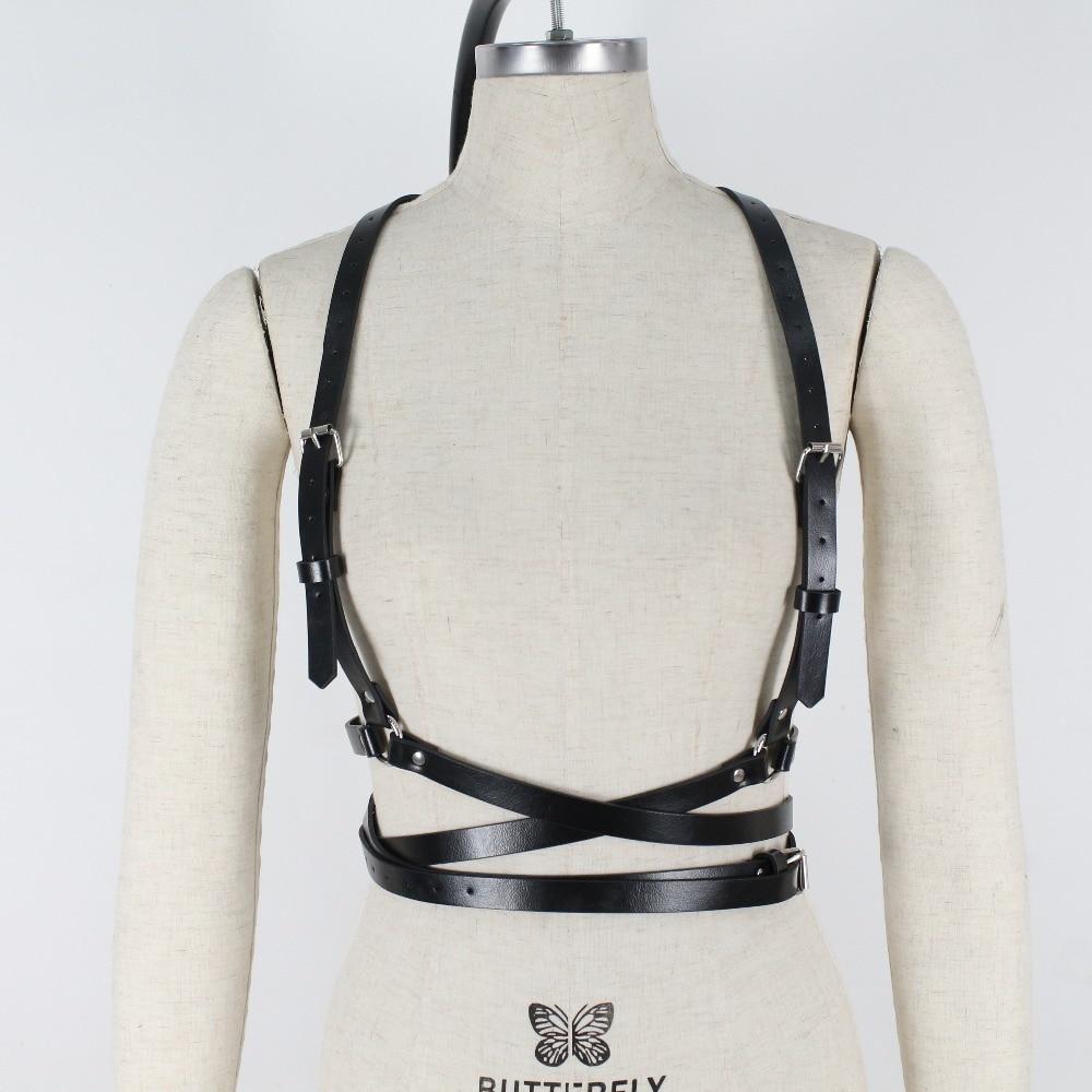 Stylish gothic full body harness for women in black imitation leather, designed for a daring, fashionable look.