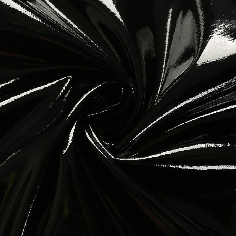 Close-up of shiny black synthetic leather fabric, perfect for stylish women’s crop tops and aesthetic outfits.