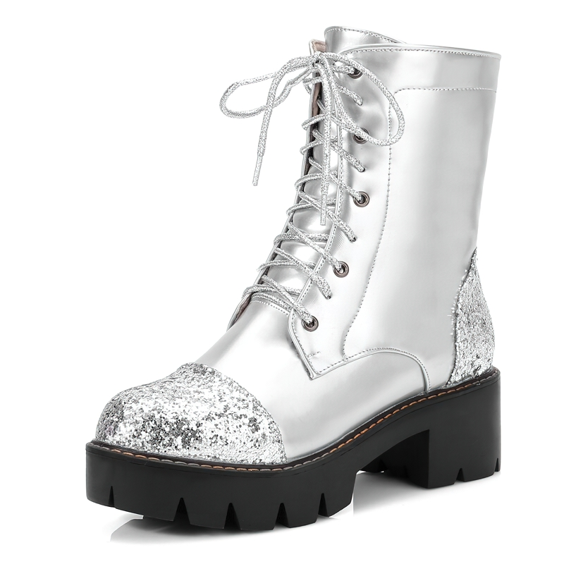 Stylish women's silver ankle boots with thick heels and glitter accents, perfect for casual fashion looks.