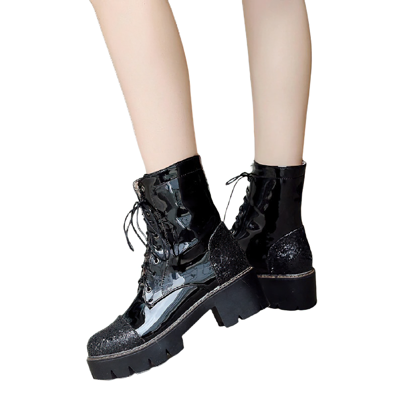 Stylish women's black ankle boots with thick heels, trendy lace-up design, perfect for casual fashion outfits.