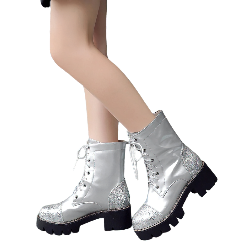 Stylish women's ankle boots in silver PU leather with glittery accents and thick heels for a fashionable look.