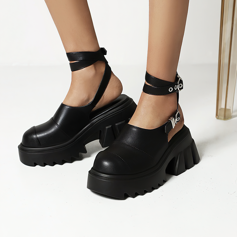 Stylish women's buckle strap platform sandals in black leather with a chunky sole and adjustable straps.