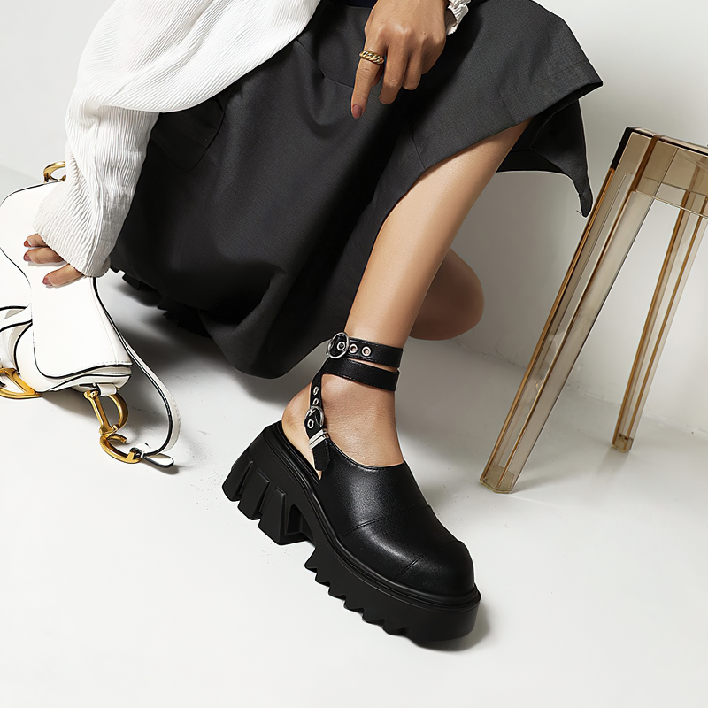 Trendy women's buckle strap platform shoes in black, featuring a stylish design and high platform for comfort and flair.