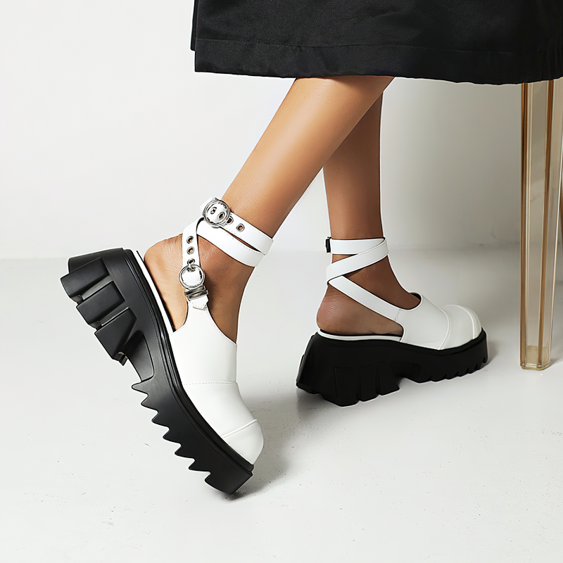 Women’s white buckle strap platform sandals with a chunky black sole, perfect for alternative fashion lovers.