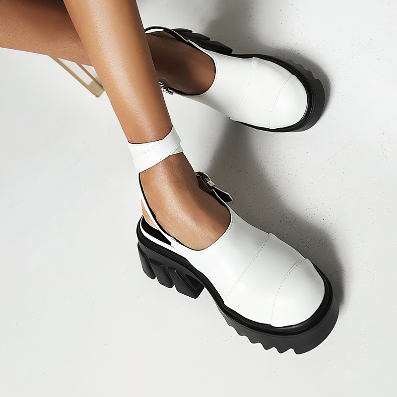 Women's white buckle strap platform sandals with chunky black sole, perfect for alternative fashion looks.