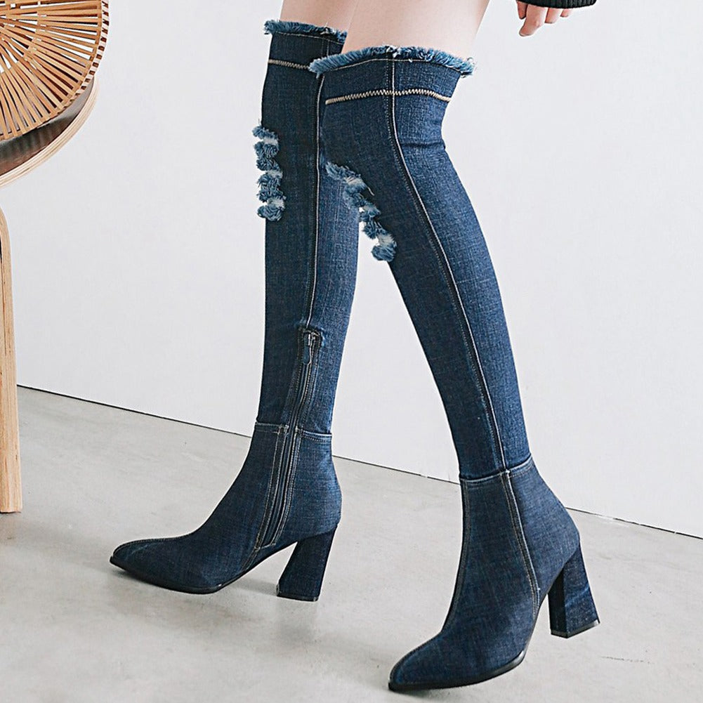 Chic women's over-the-knee denim boots with high heels and stylish frayed details.