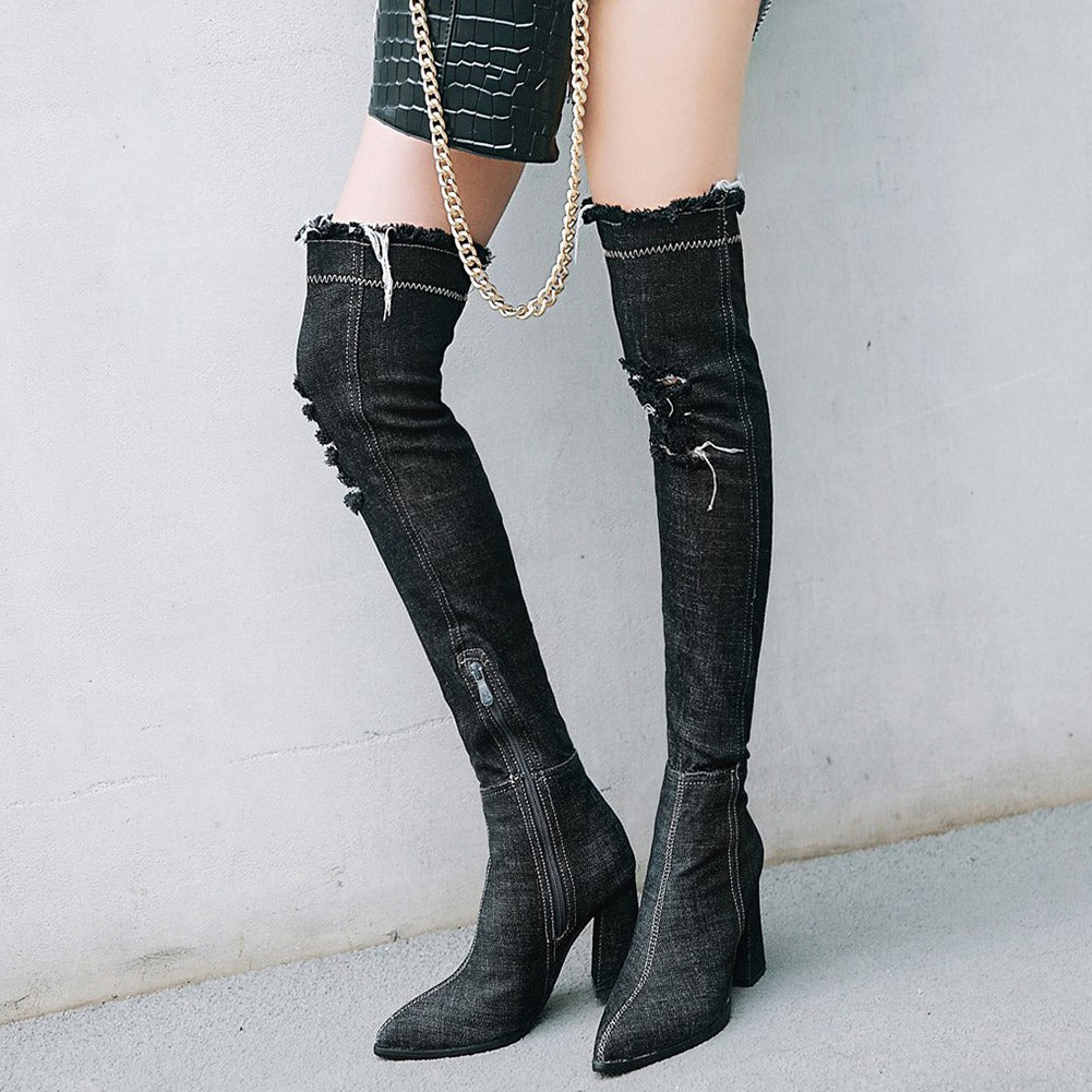 Over-the-knee denim boots with pointed toes and high heels, featuring distressed detailing and side zip, perfect for stylish outfits.