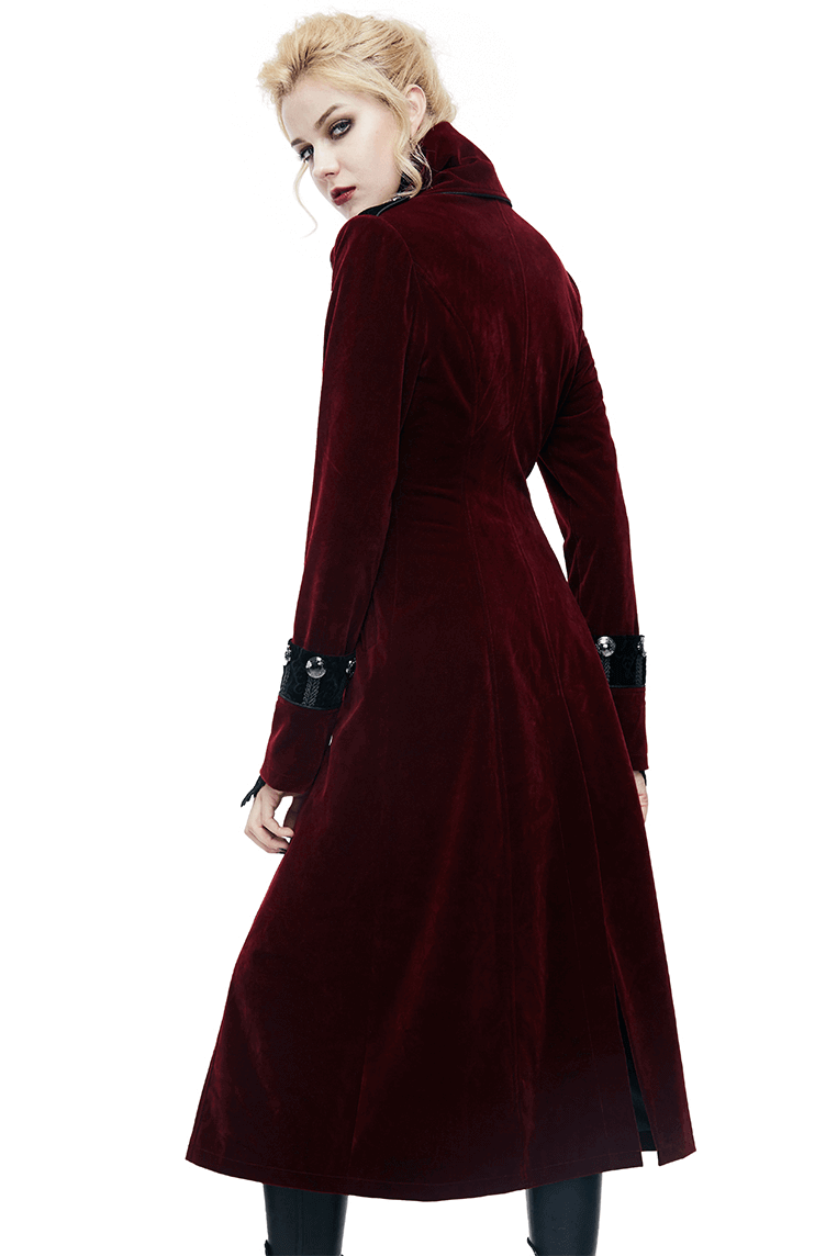 Women in a gothic style long red coat with lace inserts, showcasing a vintage look perfect for alternative fashion.