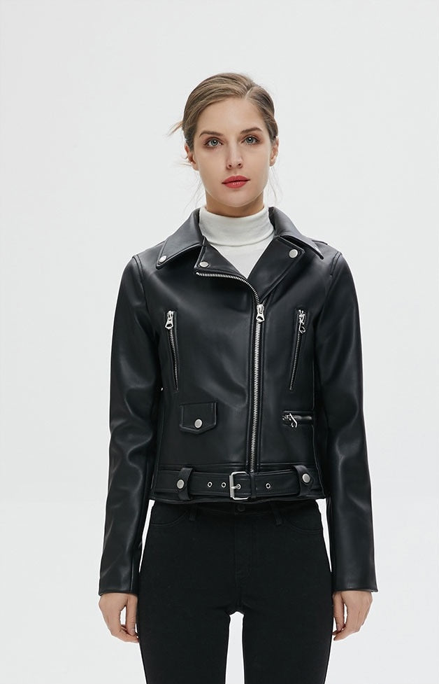 Stylish women in a faux leather biker jacket with zippers, perfect for rock and goth fashion.