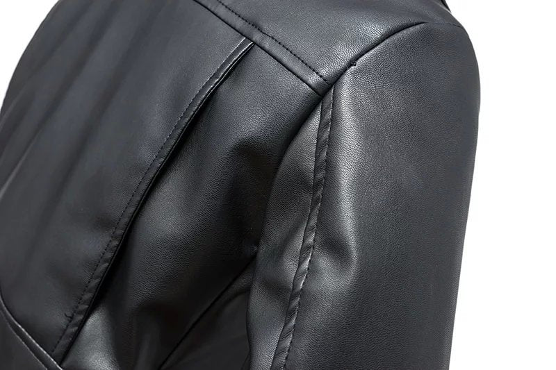 Close-up of the shoulder of a women's faux leather biker jacket showcasing its sleek material and stylish design.