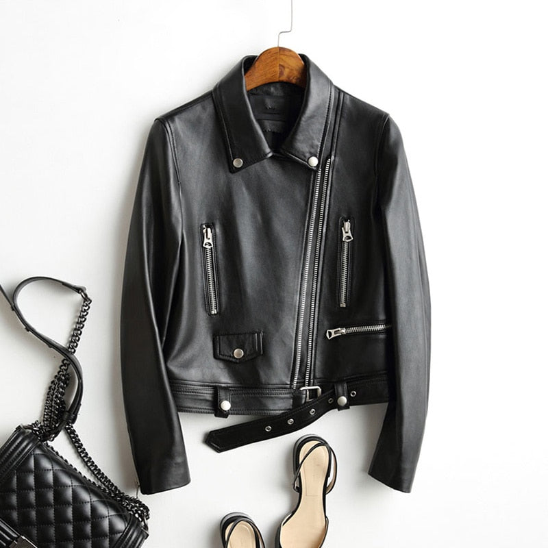 Womens faux leather biker jacket with belt, zippers, and classic rock style details.