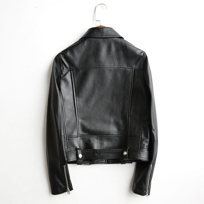 Back view of a women's faux leather biker jacket with adjustable belt and zippers, perfect for rock or goth style.