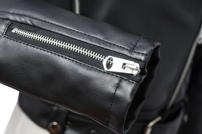 Close-up of the sleek zipper detail on a women's faux leather biker jacket, perfect for rock style outfits.