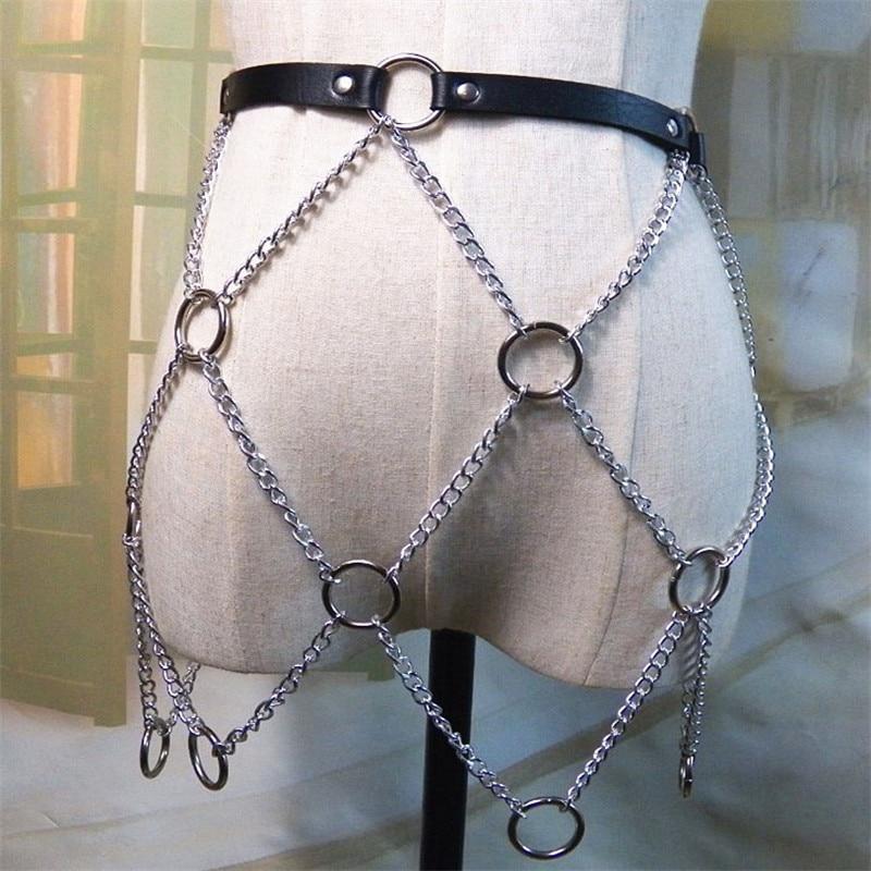 Women faux leather body harness with silver chains, perfect for a rock star fashion look on skirts or pants.