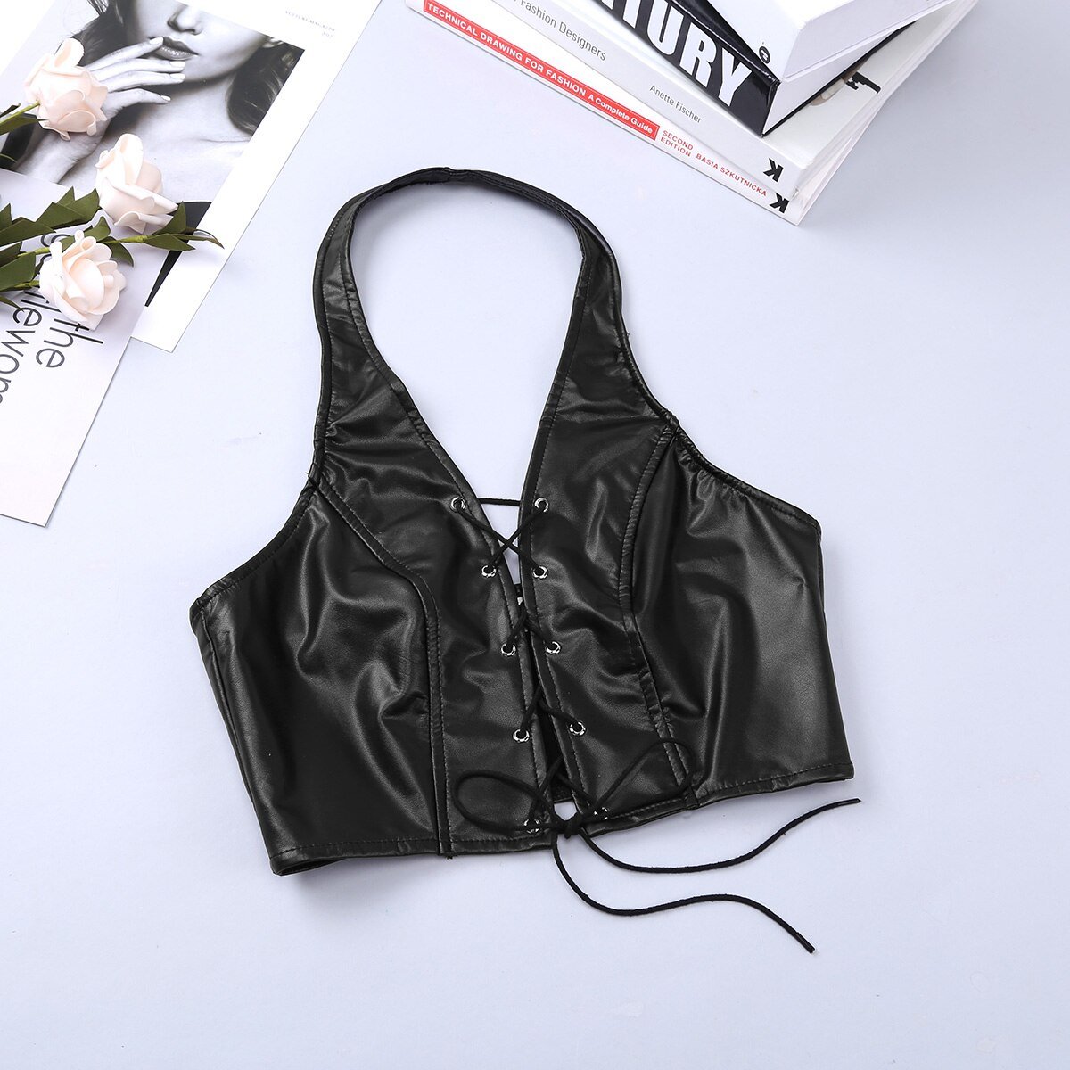 Women's vintage faux leather black lace-up bra top, perfect for gothic rock style outfits.