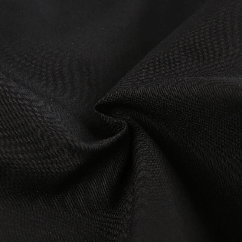 Close-up of soft black fabric showcasing the texture of women's gothic punk wide-leg cargo pants.