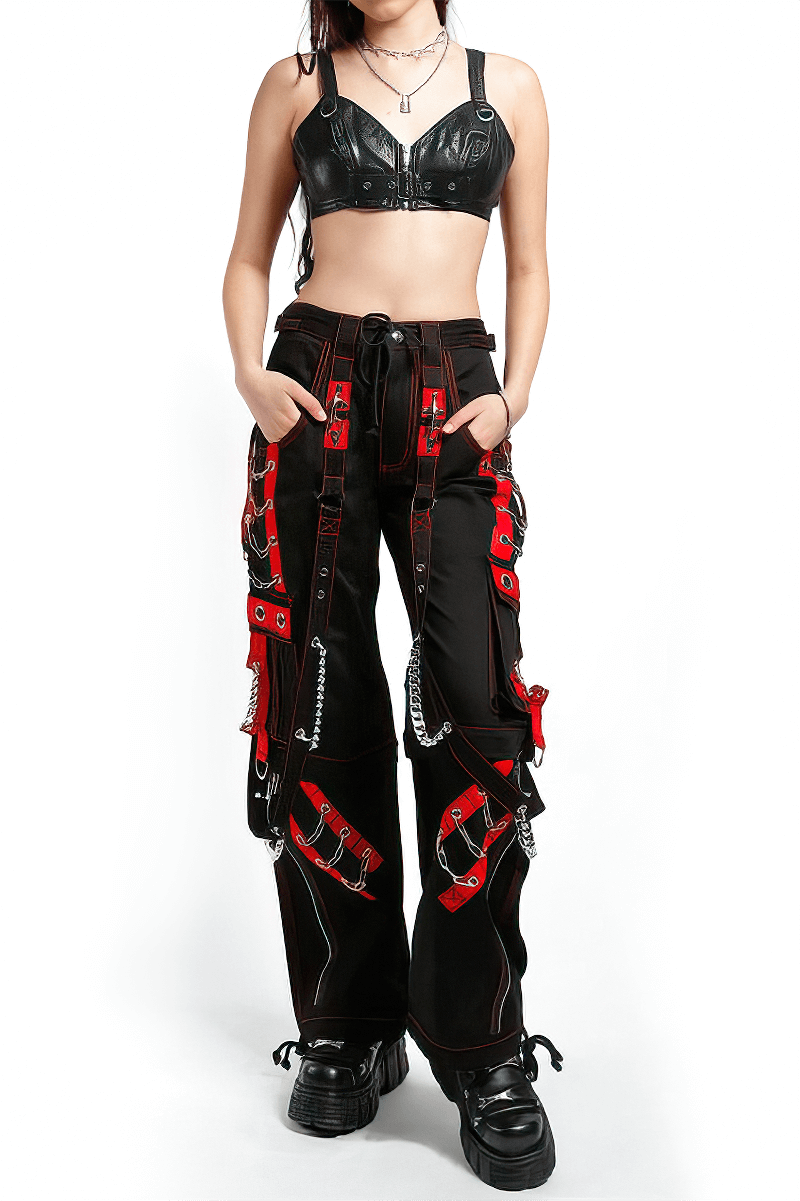 Women's black gothic punk cargo pants with red details and chains, paired with a black leather crop top.