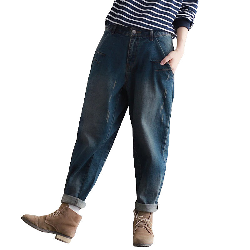 Plus size women's boyfriend jeans in dark denim, perfect for urban style and alternative fashion.
