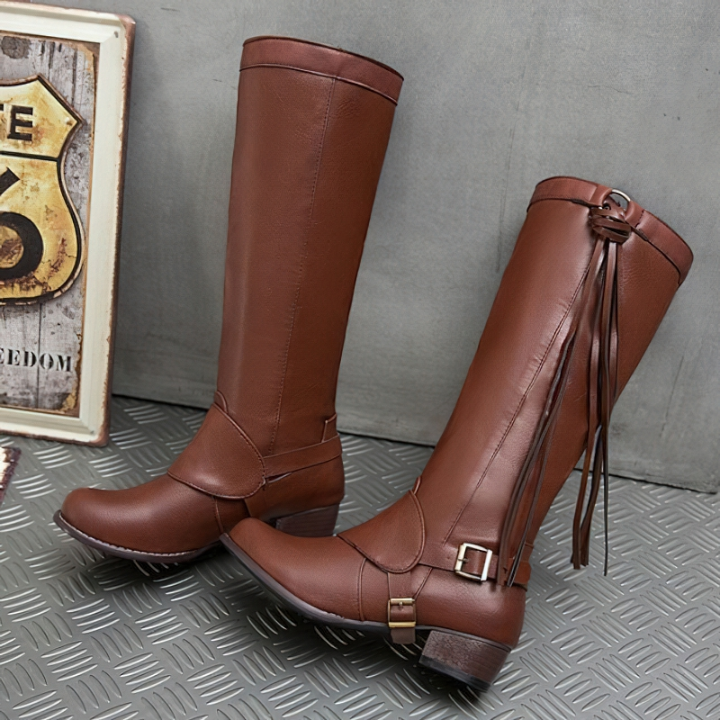 Stylish women's knee boots in brown PU leather with buckle and tassel detail, perfect for casual wear.