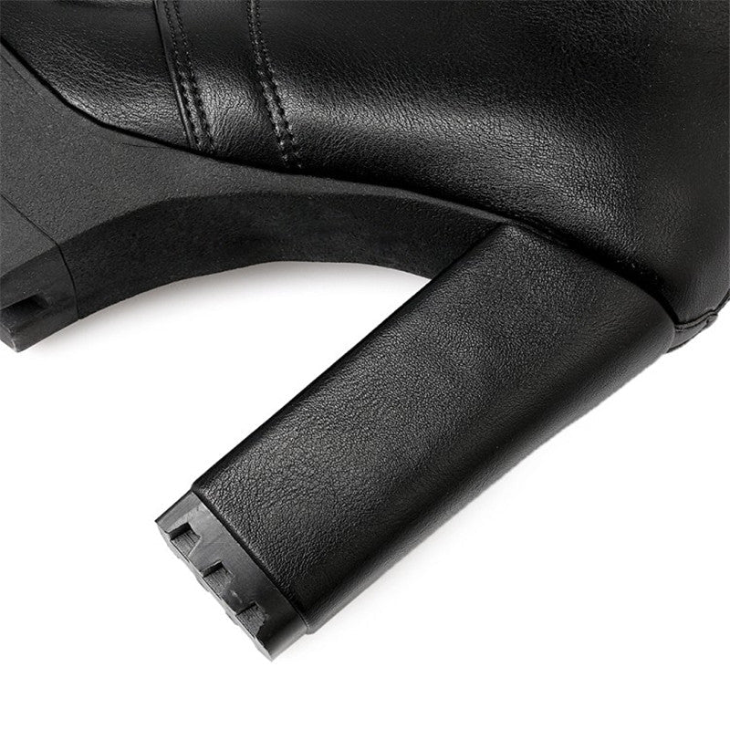 Close-up of black lacing platform boot heel showcasing the sleek square design, perfect for gothic outfits.