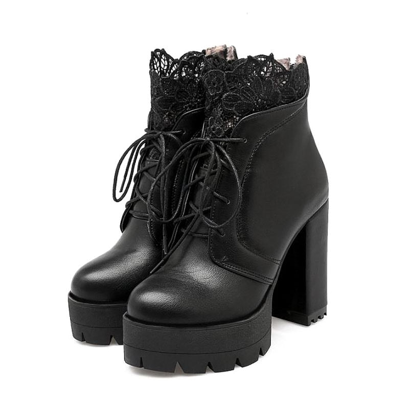 Women Gothic lace-up platform boots in black with high heels and floral decoration, perfect for stylish outfits.