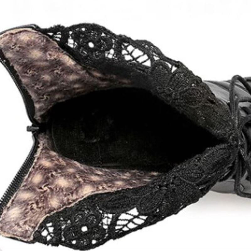 Inside view of black gothic lacing platform boot showcasing lace trim and soft lining.