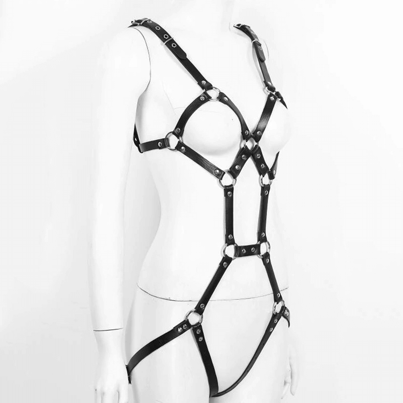 Black leather body harness with metal elements, perfect for dance, cosplay, or intimate settings. Fashionable gothic suspenders bra garter.