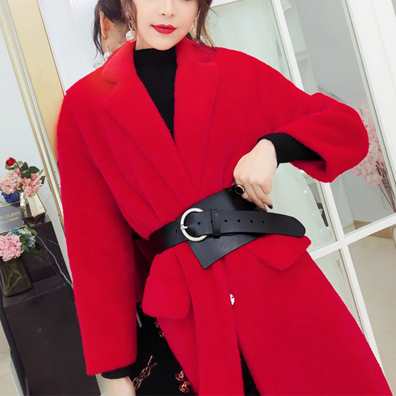 Model wearing a red coat with a black PU leather waist corset belt and stylish accessories.