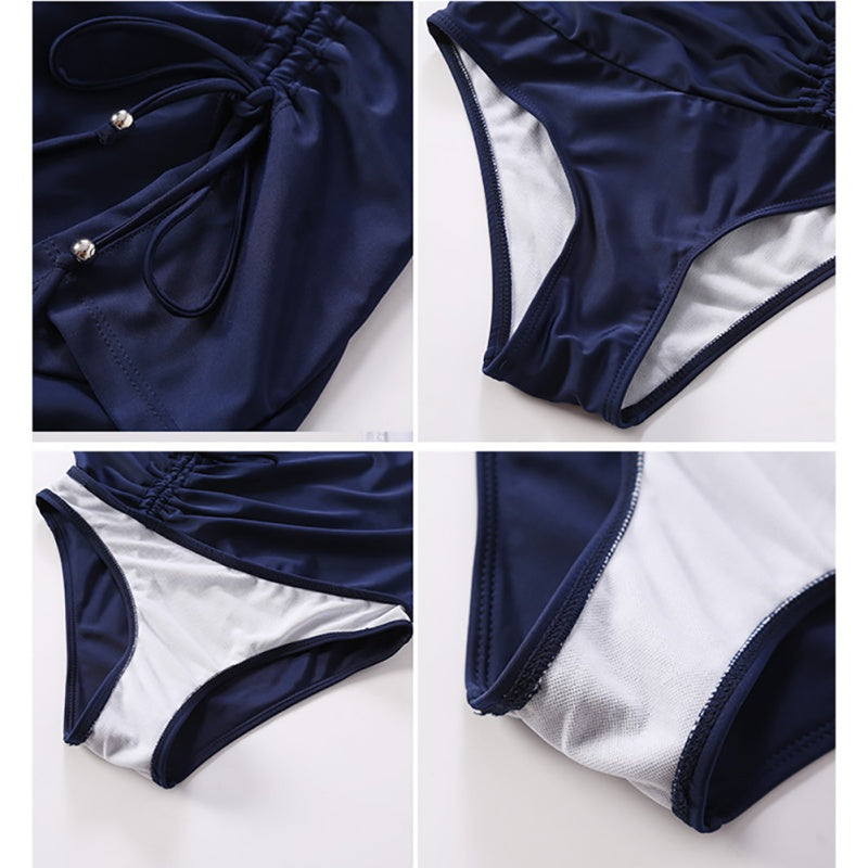 Close-up of navy women's quick-dry swim skirt and trunks with drawstring beads, showcasing fabric details.