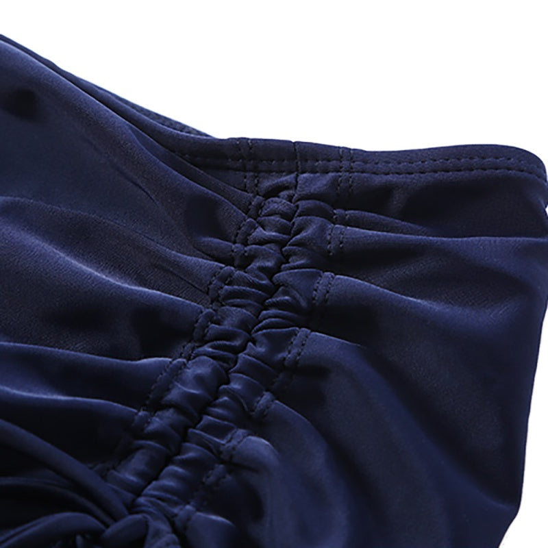 Close-up of twisted drawstring detail on women's quick-dry swim skirt in navy blue, perfect for beachwear.