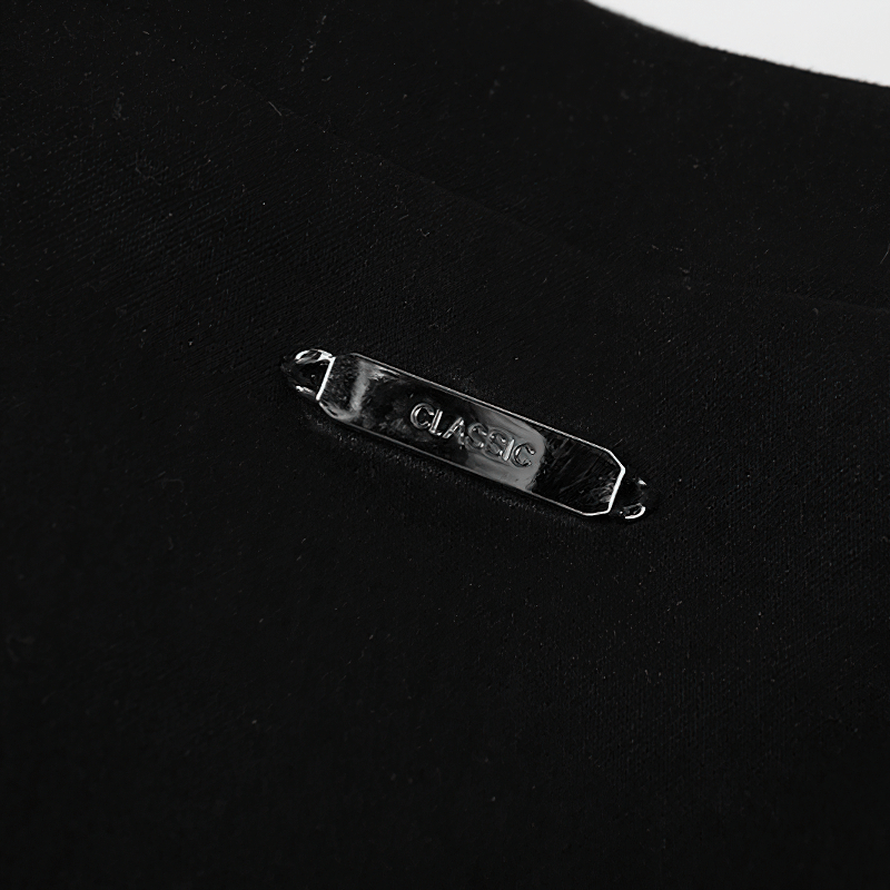 Close-up of the classic label on a black flared skirt, showcasing quality craftsmanship and style.
