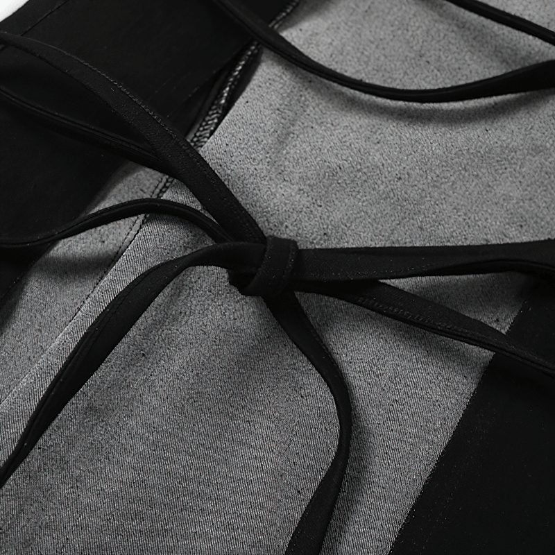 Close-up of the intricate lacing detail on a women's black flared skirt, showcasing gothic style craftsmanship.