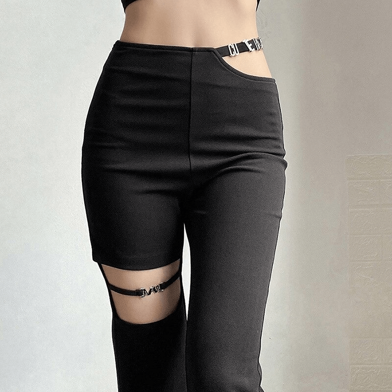 Close-up of women's black high-waisted flare pants featuring stylish cut-outs and unique design elements for an aesthetic look.
