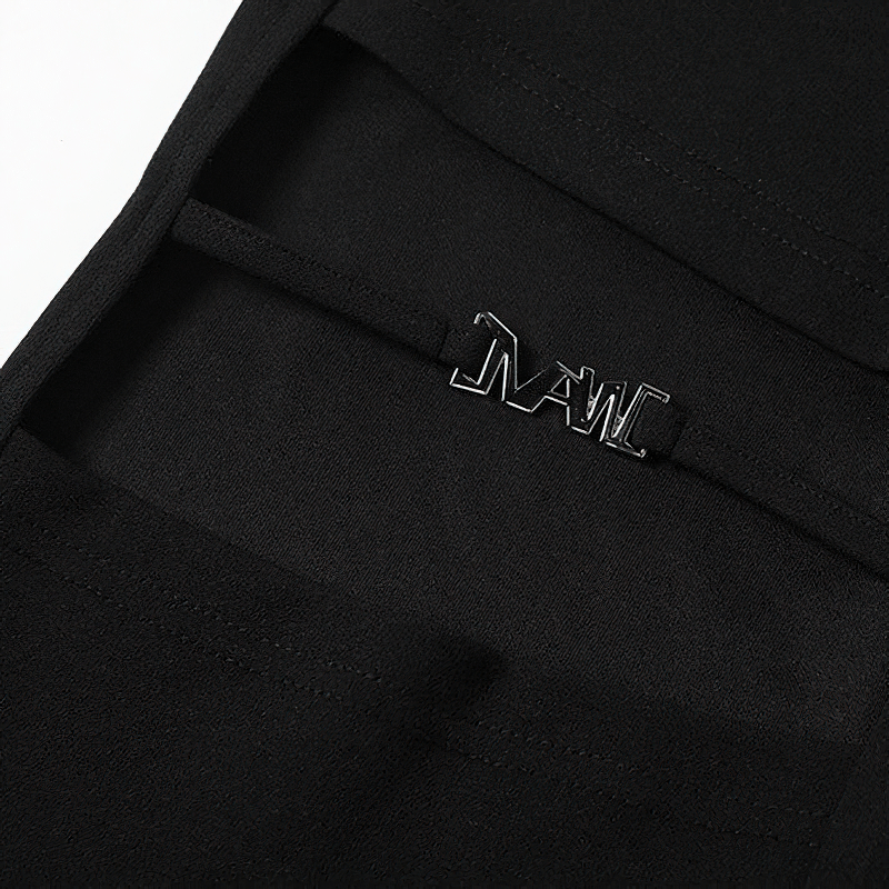 Close-up of stylish black flare pants showcasing sleek logo and fabric details for women's fashion.